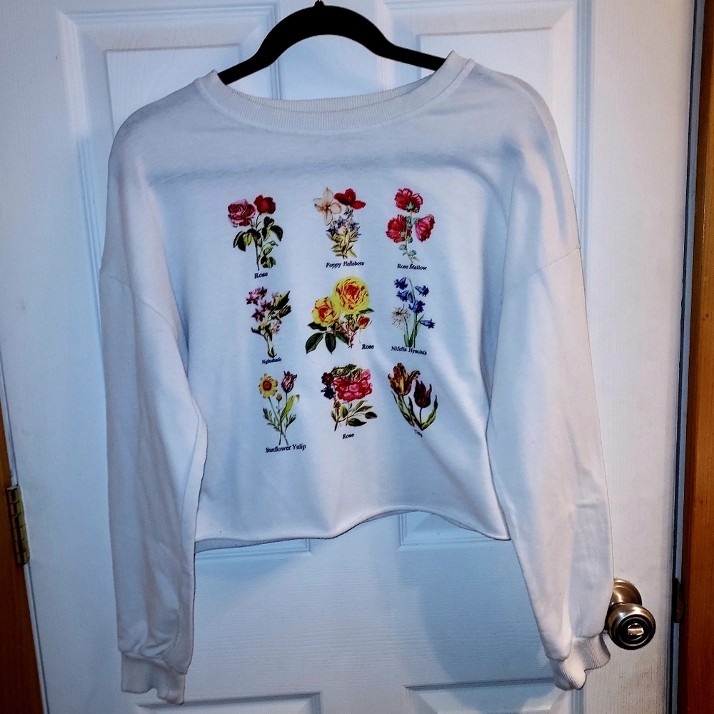 A white long sleeve with flowers, size small